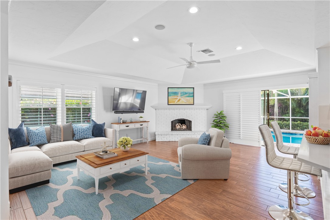 1939 Ocean Ridge Circle Vero Beach, FL 32963 - Photo 9 of 33 a living room with furniture and a large window