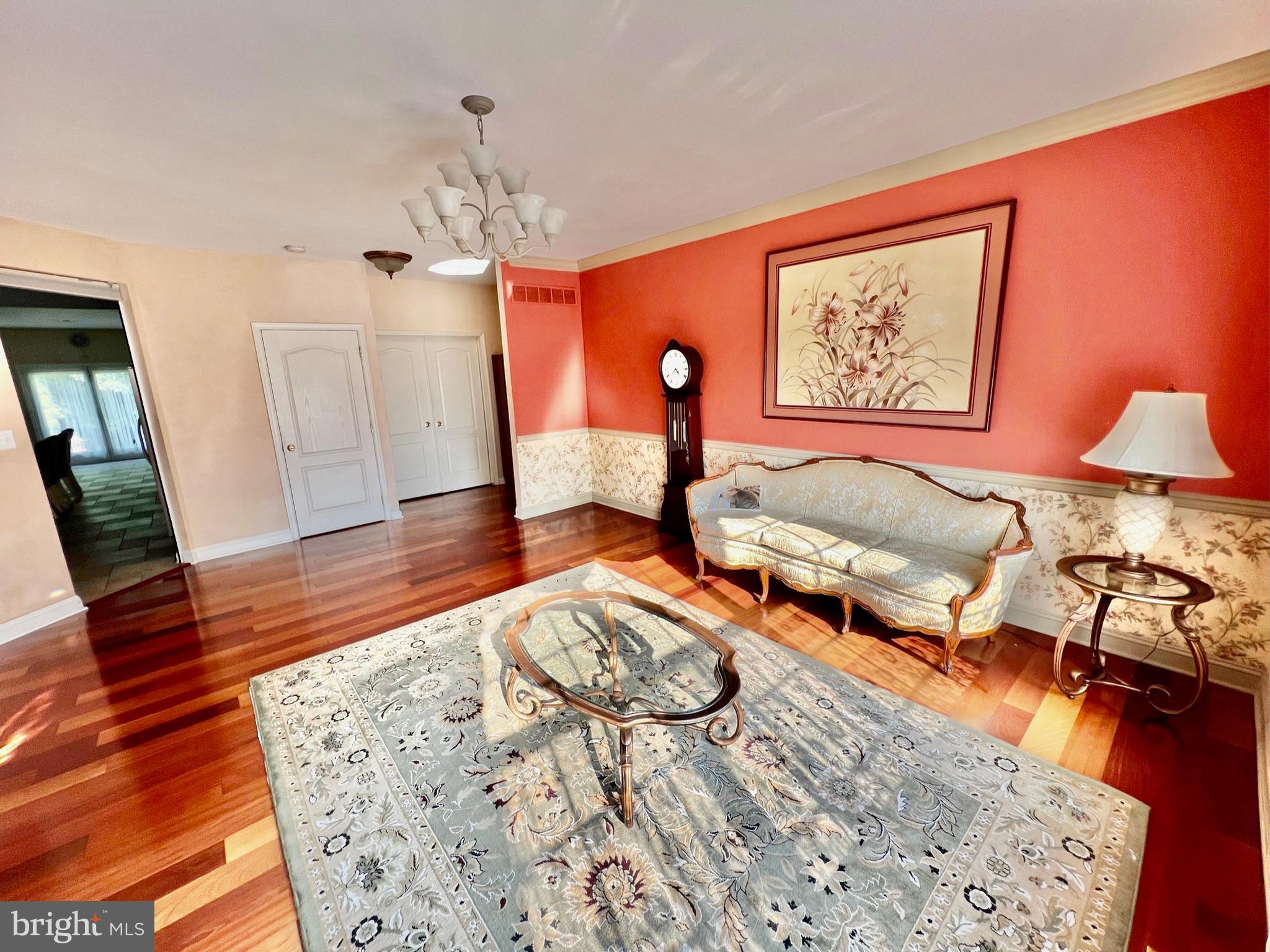 18 Skyline Circle Sewell, NJ 08080 - Photo 12 of 59 a living room with furniture and a chandelier