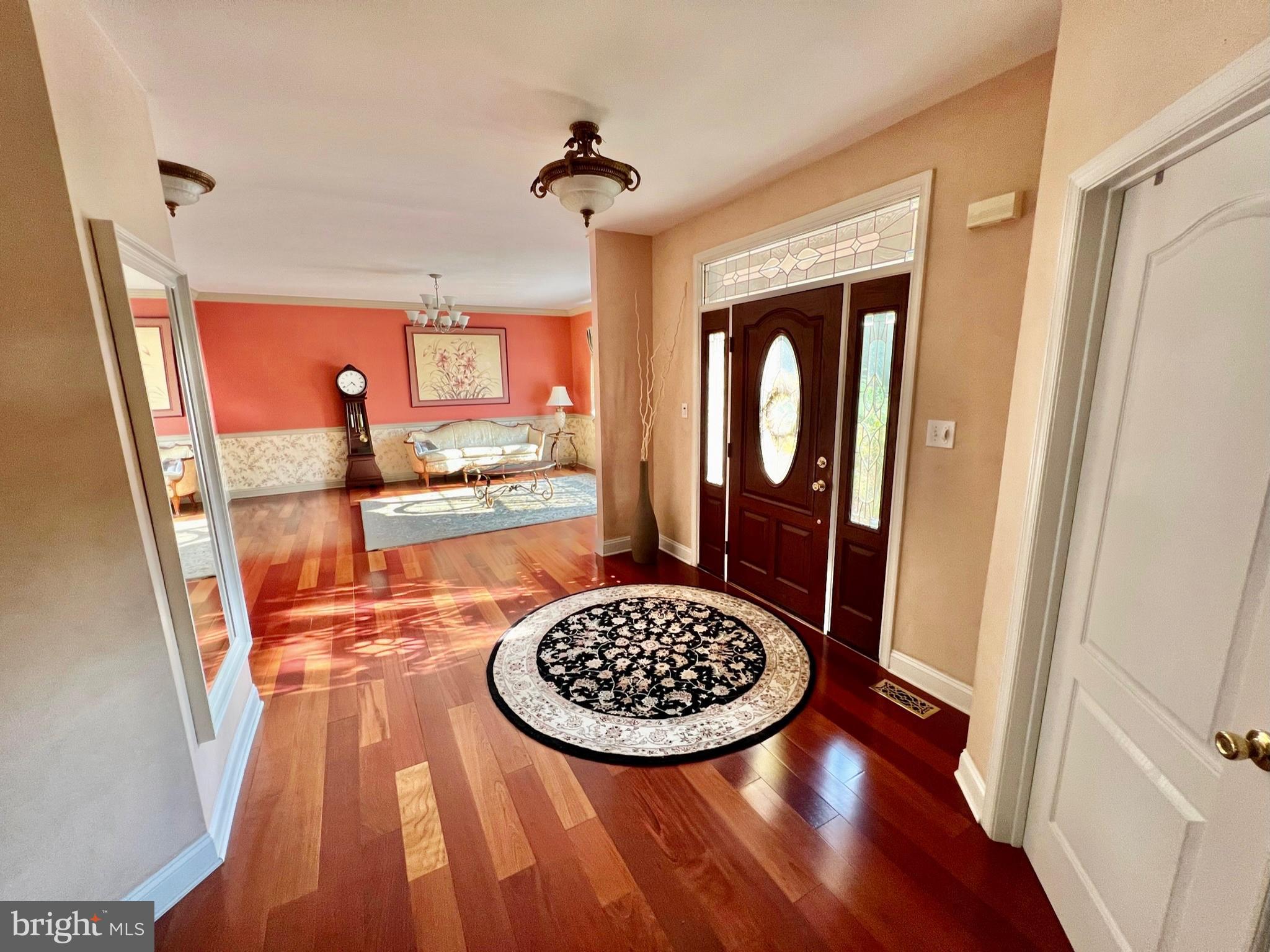 18 Skyline Circle Sewell, NJ 08080 - Photo 13 of 59 a view of a hallway with wooden floor and dining table