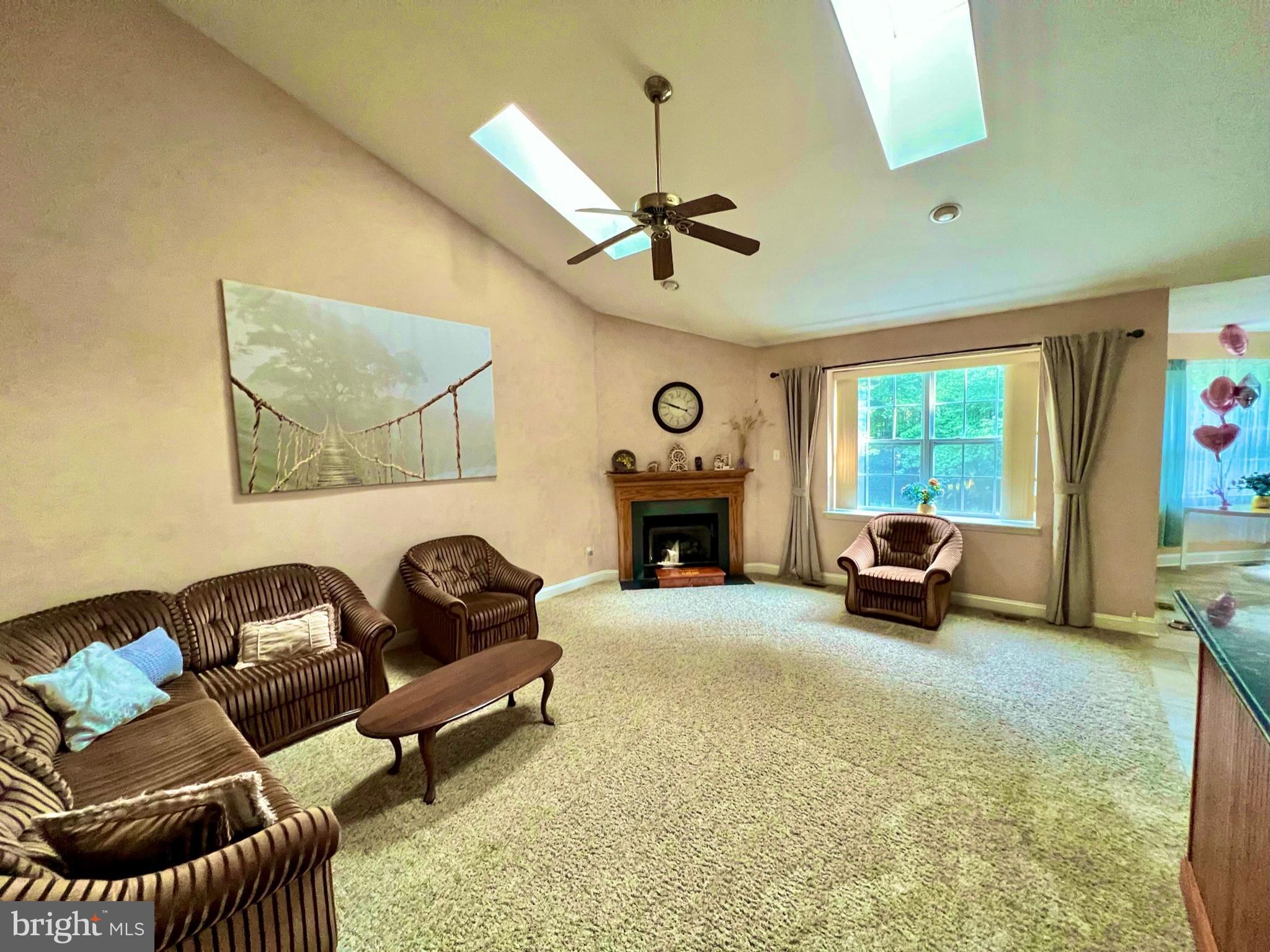 18 Skyline Circle Sewell, NJ 08080 - Photo 15 of 59 a living room with furniture and a fireplace