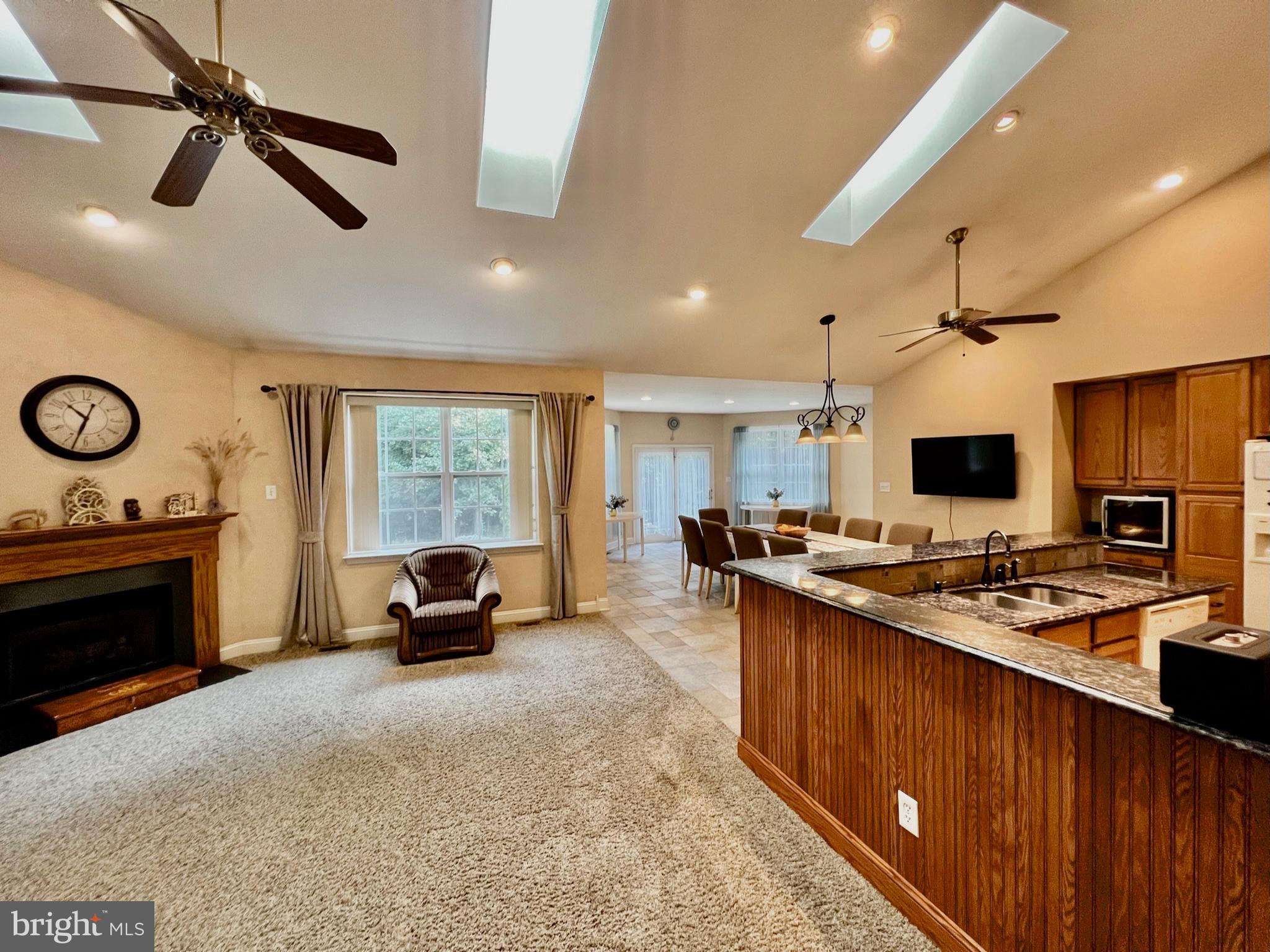 18 Skyline Circle Sewell, NJ 08080 - Photo 17 of 59 a living room with furniture a fireplace and a flat screen tv