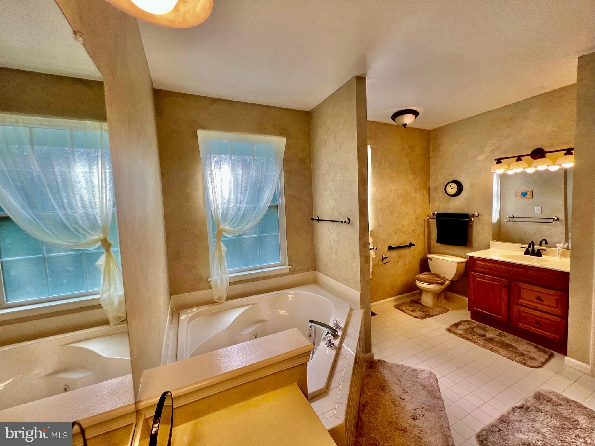 18 Skyline Circle Sewell, NJ 08080 - Photo 39 of 59 a bedroom with a bed and a mirror