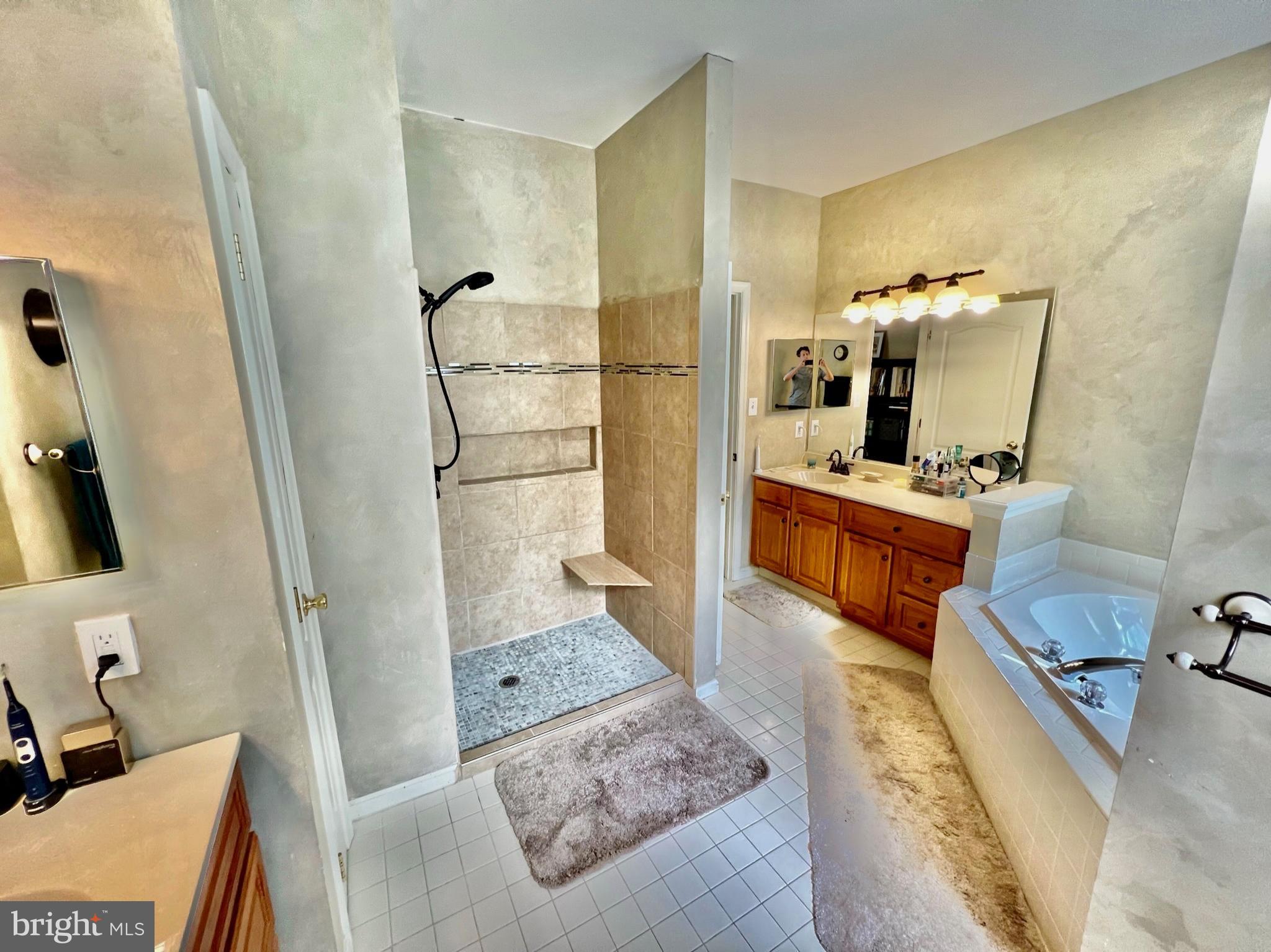 18 Skyline Circle Sewell, NJ 08080 - Photo 40 of 59 a bathroom with a tub sink and mirror