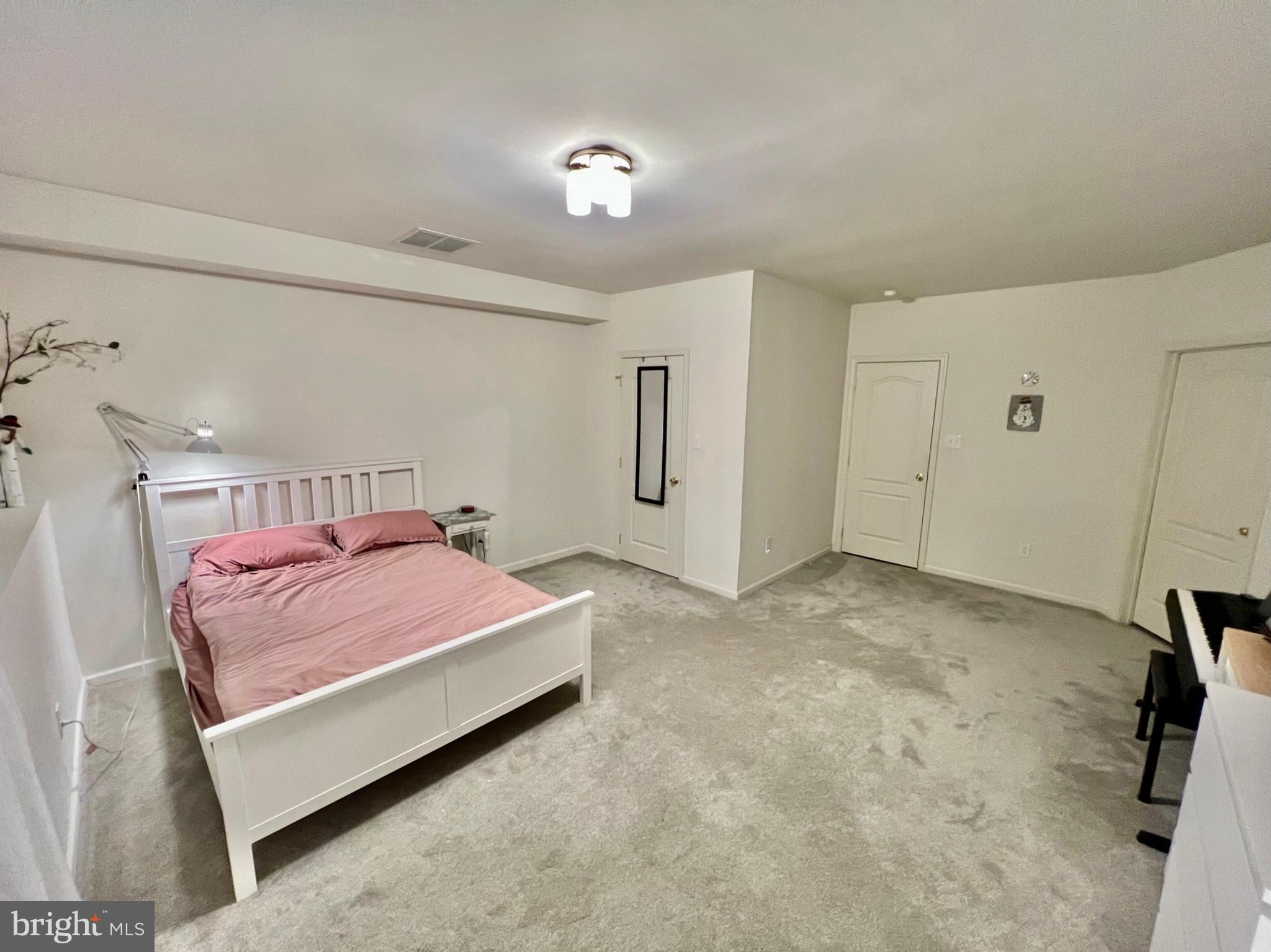 18 Skyline Circle Sewell, NJ 08080 - Photo 46 of 59 a bedroom with a bed and a chandelier