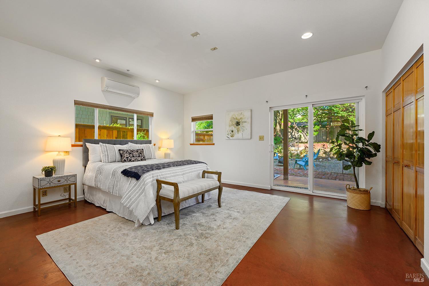285 Neva Street Sebastopol, CA 95472 - Photo 17 of 39 a spacious bedroom with a bed and a large window
