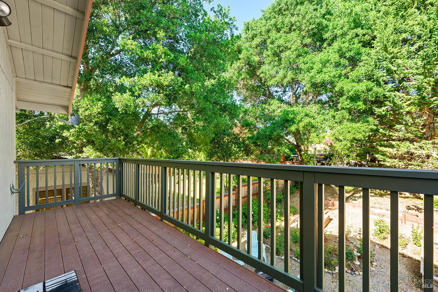 285 Neva Street Sebastopol, CA 95472 - Photo 24 of 39 a balcony with wooden floor and trees in the background