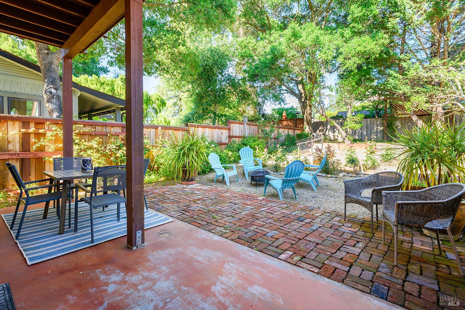 285 Neva Street Sebastopol, CA 95472 - Photo 33 of 39 a backyard of a house with fountain table and chairs