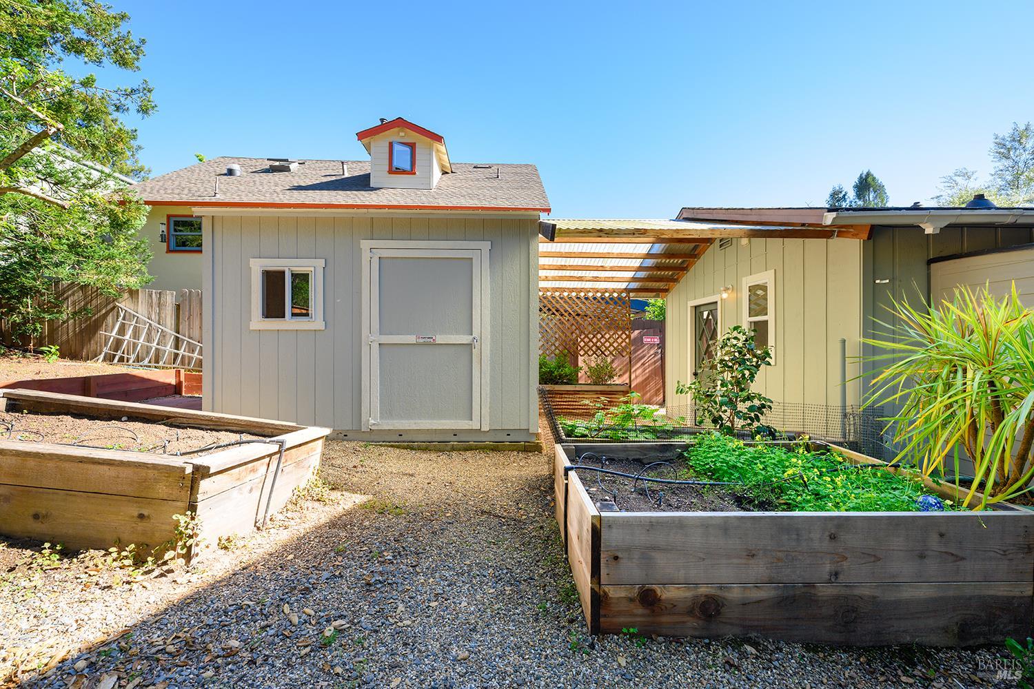 285 Neva Street Sebastopol, CA 95472 - Photo 36 of 39 a view of a house with a tub and potted plants