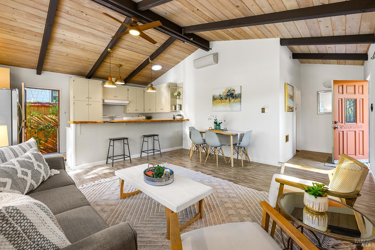 285 Neva Street Sebastopol, CA 95472 - Photo 6 of 39 a living room with furniture and a dining table with kitchen view