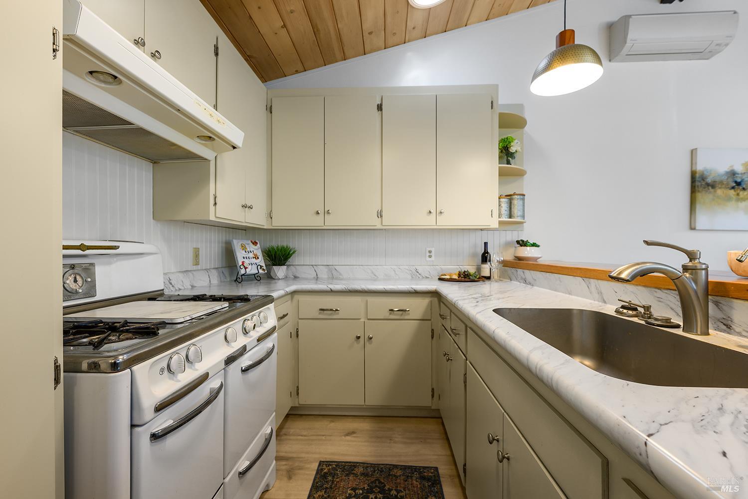 285 Neva Street Sebastopol, CA 95472 - Photo 9 of 39 a kitchen with a sink cabinets and stainless steel appliances