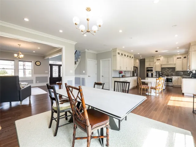 a view of a dining area with furniture and wooden floor