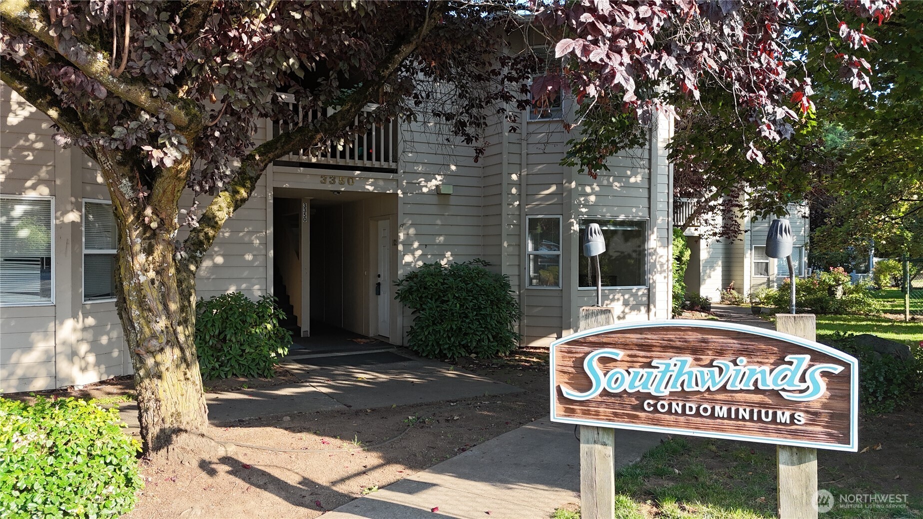 3350 Northwest Avenue, Unit 102 Bellingham, WA 98225 - Photo 2 of 28 a sign on the side of a building