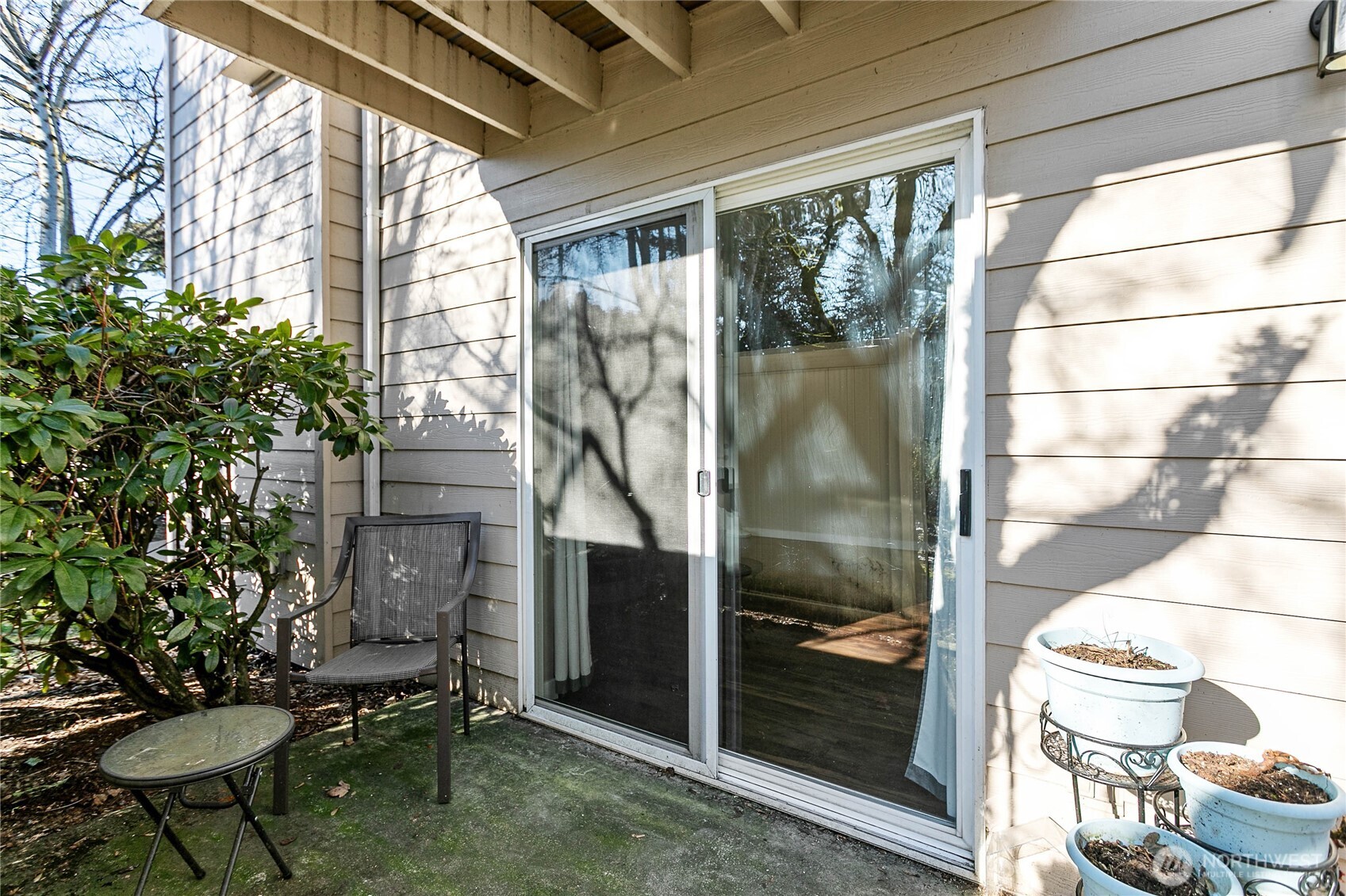 3350 Northwest Avenue, Unit 102 Bellingham, WA 98225 - Photo 28 of 28 a balcony with table and chairs