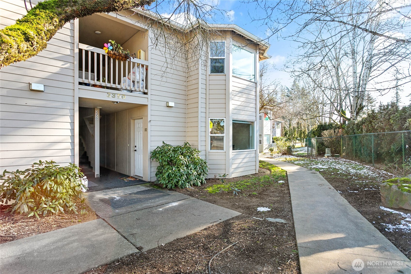 3350 Northwest Avenue, Unit 102 Bellingham, WA 98225 - Photo 6 of 28 a front view of a house with garden