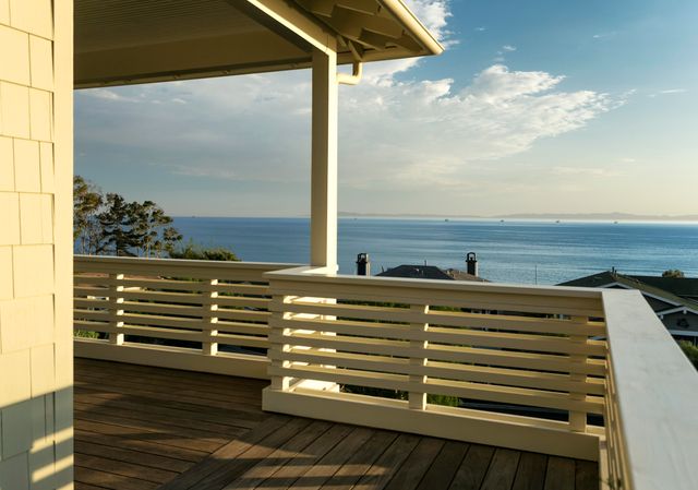 a view of a balcony with two chairs and a table