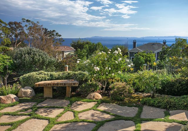 aerial view of a house with yard and sitting area