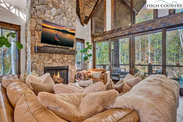 a living room with furniture fireplace and flat screen tv