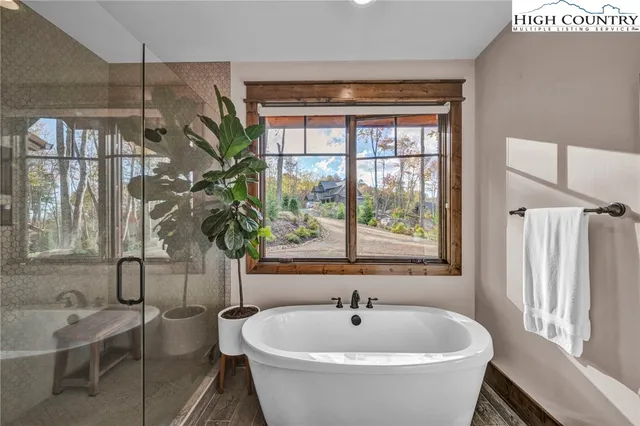 a white bath tub sitting next to a window
