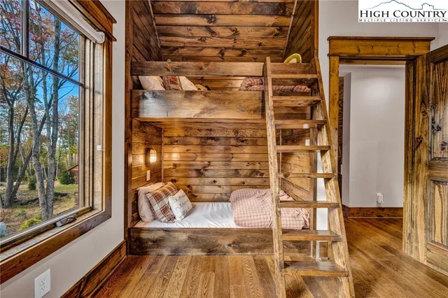 a view of a balcony with wooden floor and iron floor
