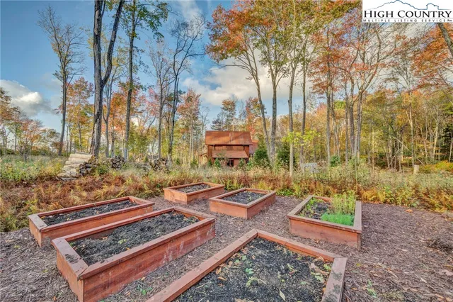 a view of a backyard with sitting area