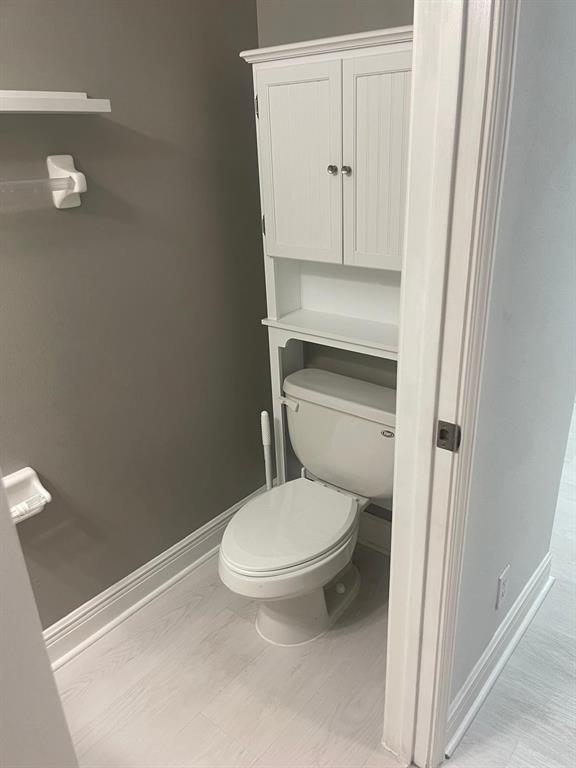 9967 Northwest 56th Place, Unit 9967 Coral Springs, FL 33076 - Photo 12 of 38 a bathroom with a toilet