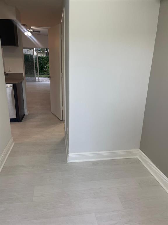 9967 Northwest 56th Place, Unit 9967 Coral Springs, FL 33076 - Photo 14 of 38 a view of hallway with workspace