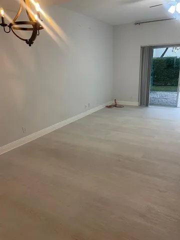 a view of an empty room with windows