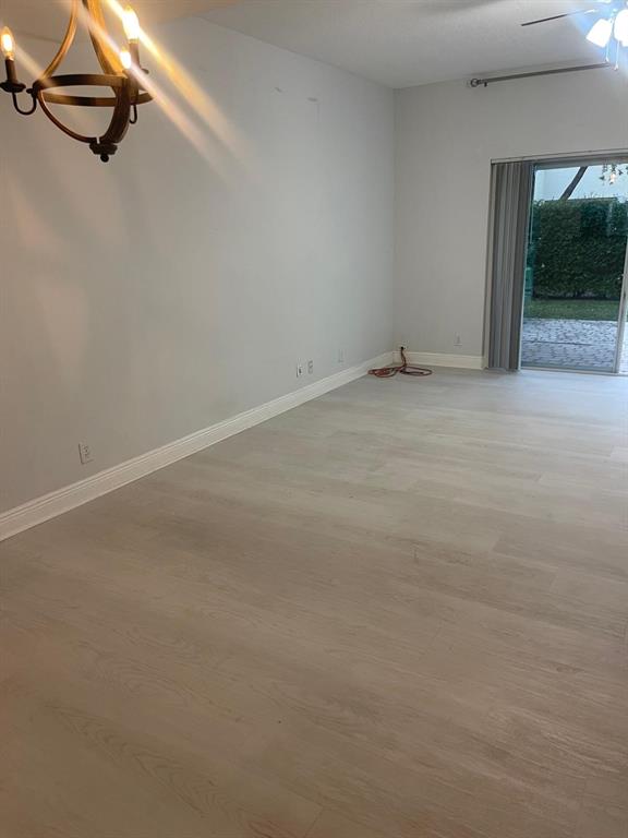 9967 Northwest 56th Place, Unit 9967 Coral Springs, FL 33076 - Photo 15 of 38 a view of a room with rack on the wall