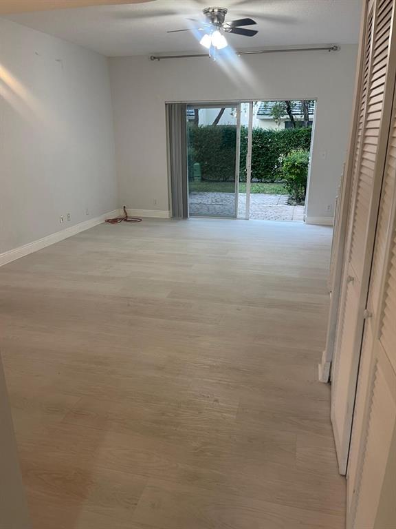 9967 Northwest 56th Place, Unit 9967 Coral Springs, FL 33076 - Photo 16 of 38 a view of an empty room with windows