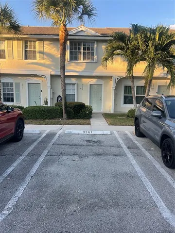 a view of a car parked in front of a house