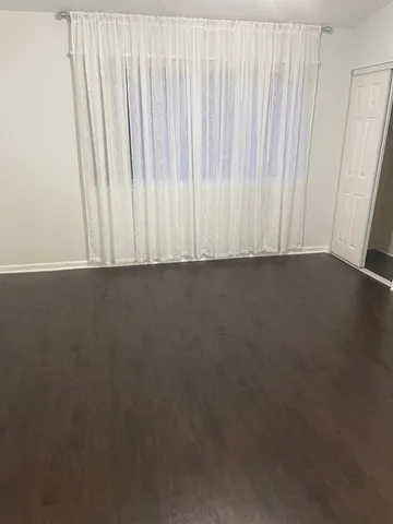a bathroom with a granite countertop sink vanity and mirror