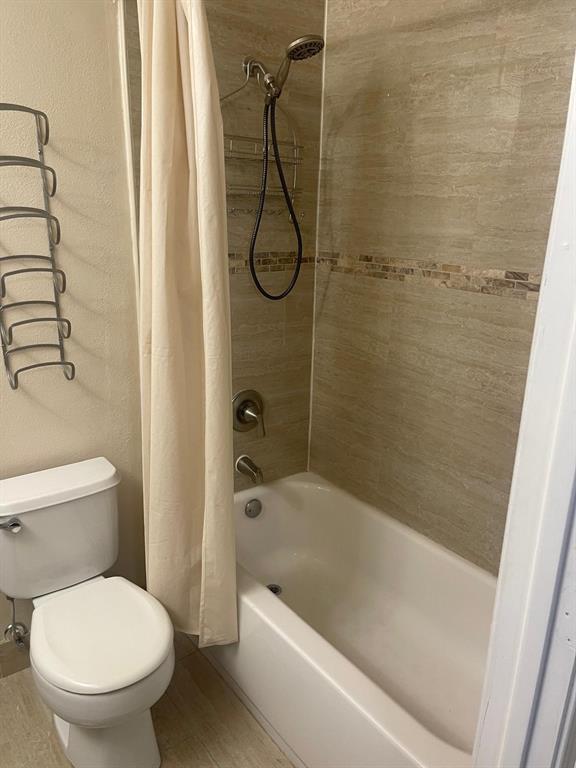 9967 Northwest 56th Place, Unit 9967 Coral Springs, FL 33076 - Photo 29 of 38 a bathroom with a toilet and a shower
