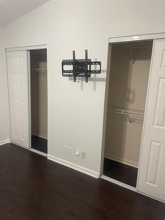 9967 Northwest 56th Place, Unit 9967 Coral Springs, FL 33076 - Photo 32 of 38 an empty room with wooden floor