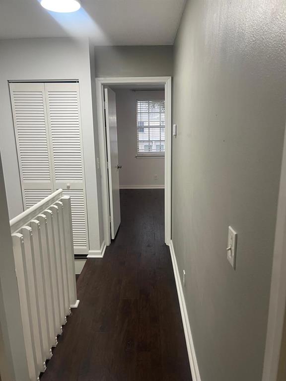 9967 Northwest 56th Place, Unit 9967 Coral Springs, FL 33076 - Photo 33 of 38 a view of a hallway with windows