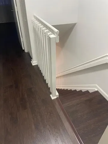 a couple of cars parked in front of a house