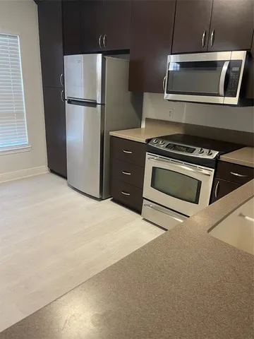 a kitchen with a sink and a stove