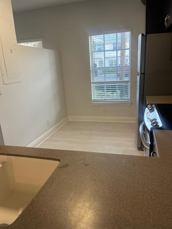 9967 Northwest 56th Place, Unit 9967 Coral Springs, FL 33076 - Photo 10 of 38 a view of an empty room with a window