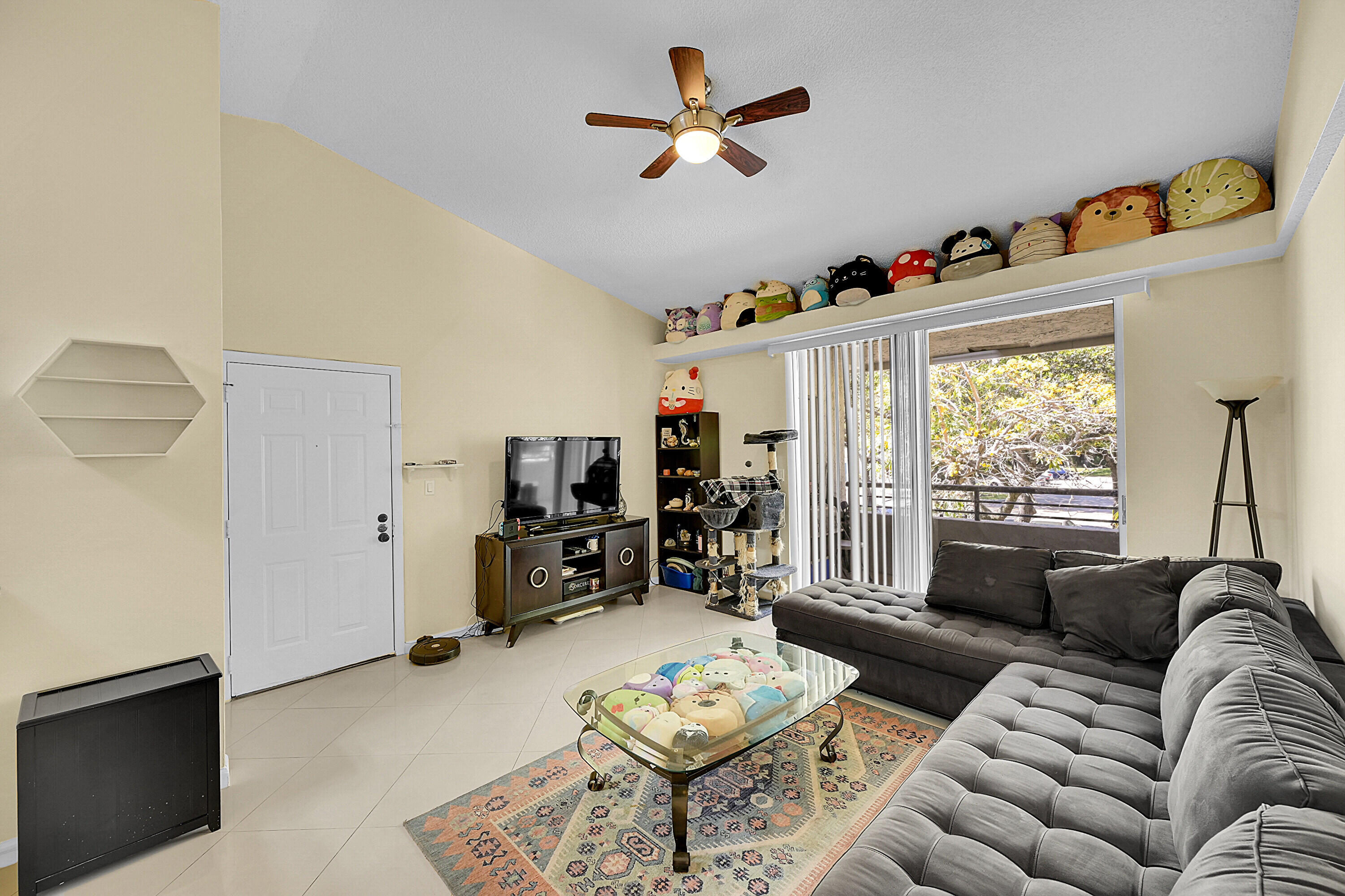 931 Lyons Road, Unit 4201 Coconut Creek, FL 33063 - Photo 18 of 47 a living room with furniture