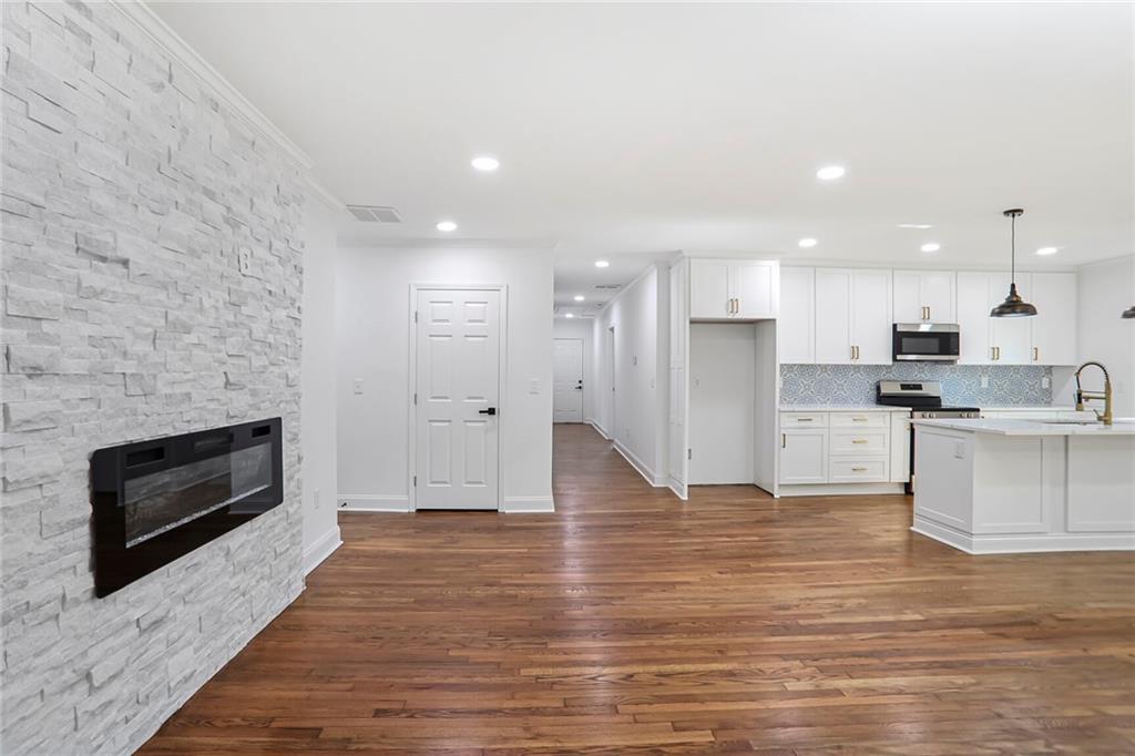 1321 Avon Avenue Southwest Atlanta, GA 30310 - Photo 2 of 20 a view of kitchen with kitchen island wooden floor and stainless steel appliances