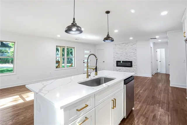 a kitchen with sink and center island