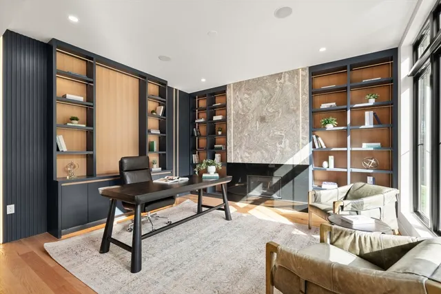 a living room with furniture a rug and a large window