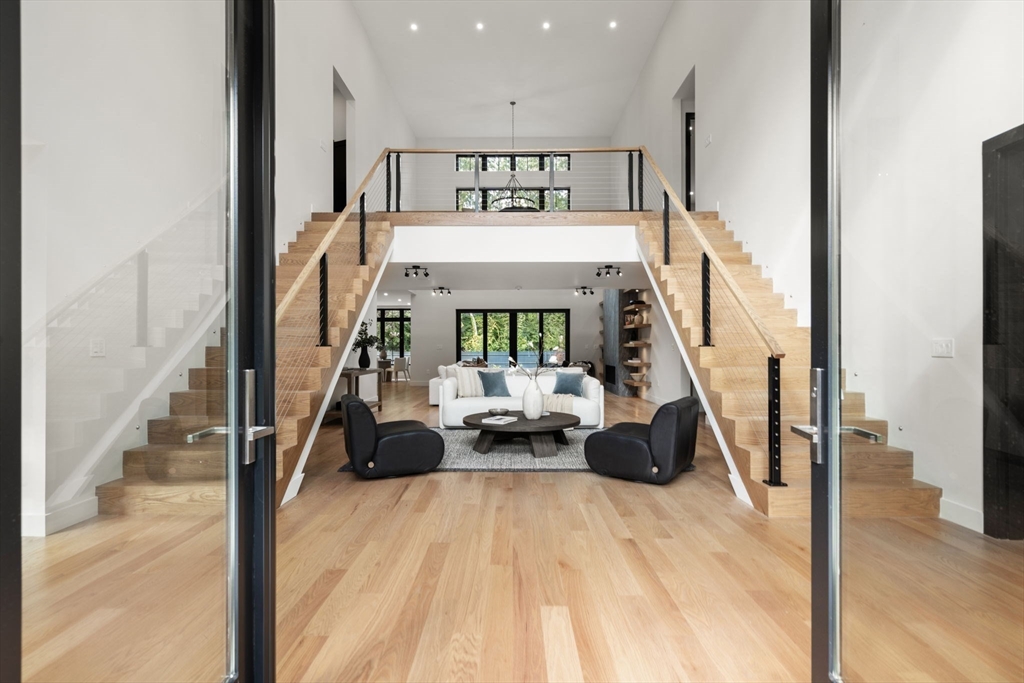 68 Locust Lane Needham, MA 02492 - Photo 2 of 39 a view of hall way with furniture and floor to ceiling window