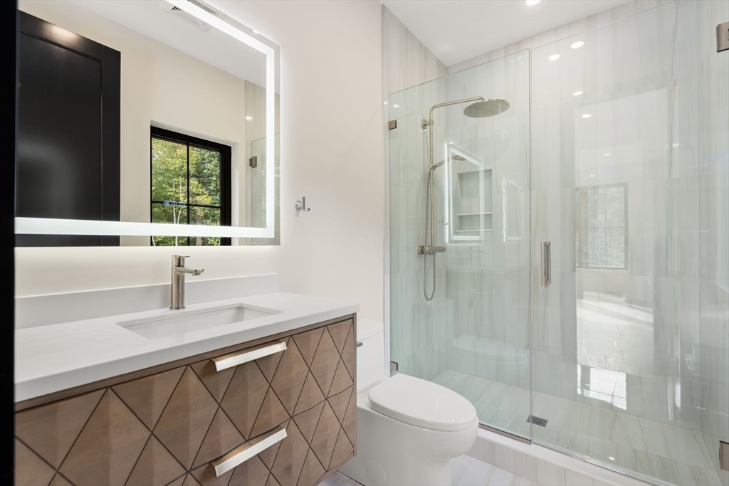 68 Locust Lane Needham, MA 02492 - Photo 27 of 39 a bathroom with a sink a toilet and shower