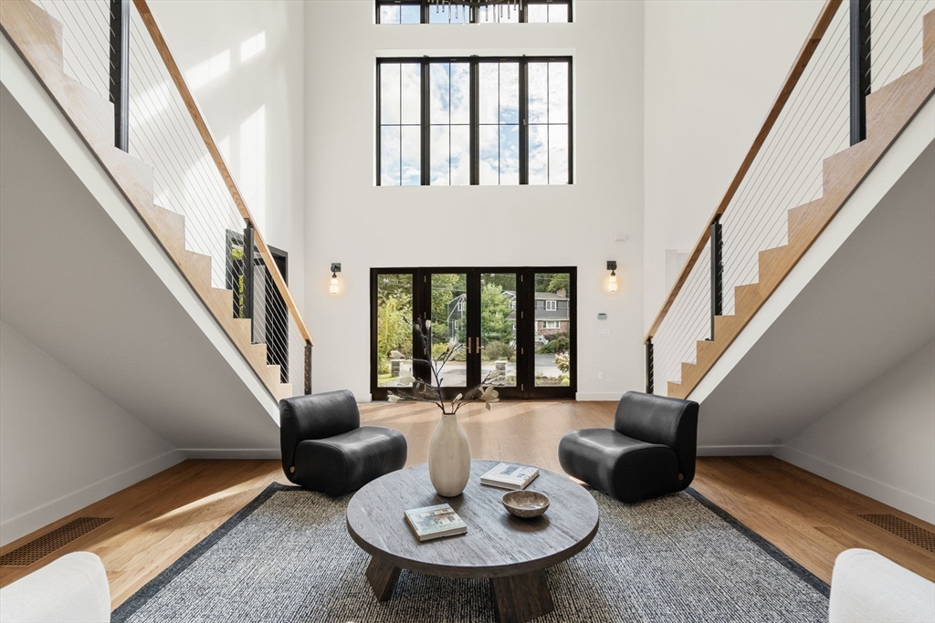 68 Locust Lane Needham, MA 02492 - Photo 3 of 39 a living room with furniture and a floor to ceiling window