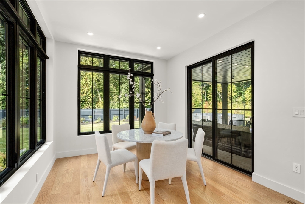 68 Locust Lane Needham, MA 02492 - Photo 10 of 39 a dining room with furniture and large windows