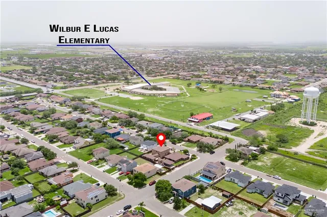 an aerial view of residential houses with outdoor space