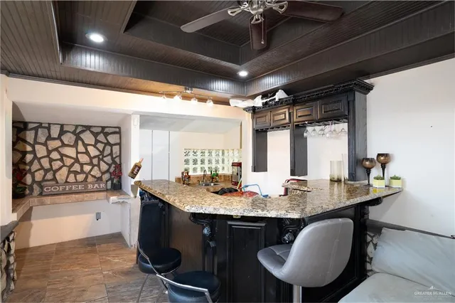 a kitchen with granite countertop lots of counter top space and dining table