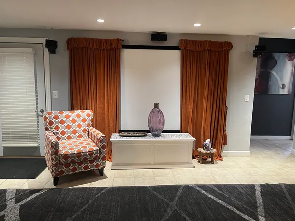 a bedroom with a bed and a large mirror