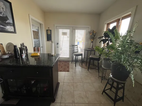 a dining room with furniture and wooden floor