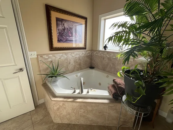 a white bath tub sitting in a bathroom